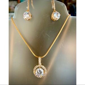 Gold toned and Cubic Zirconia Halo set.